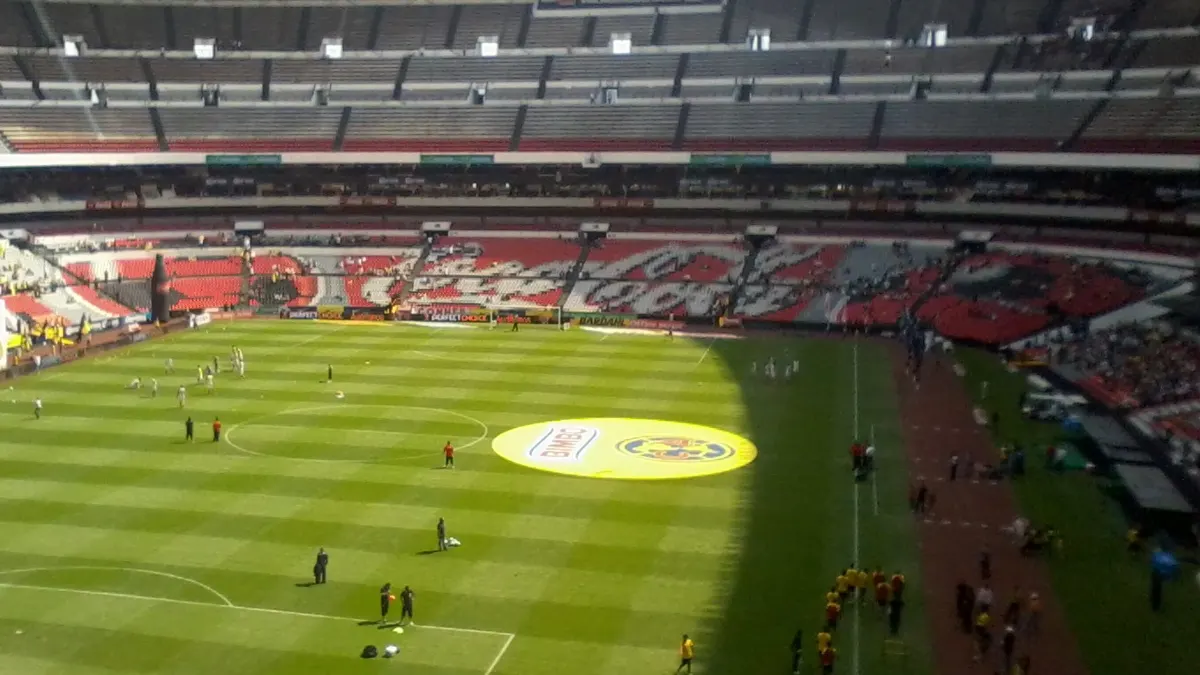 Players warming up on the pitch at the Estadio Azteca in Mexico City before Club América played Tijuana in September 2011