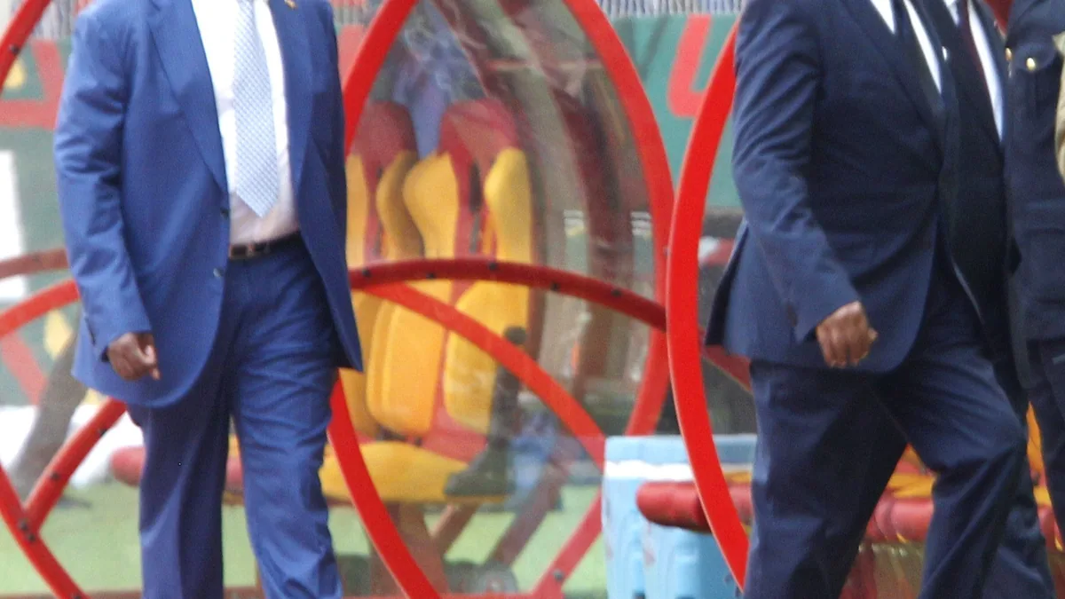 CAF president Patrice Motsepe and FIFA president Gianni Infantino walking past the team benches at the Olembe Stadium in Yaoundé during the AFCON opening in January 2022