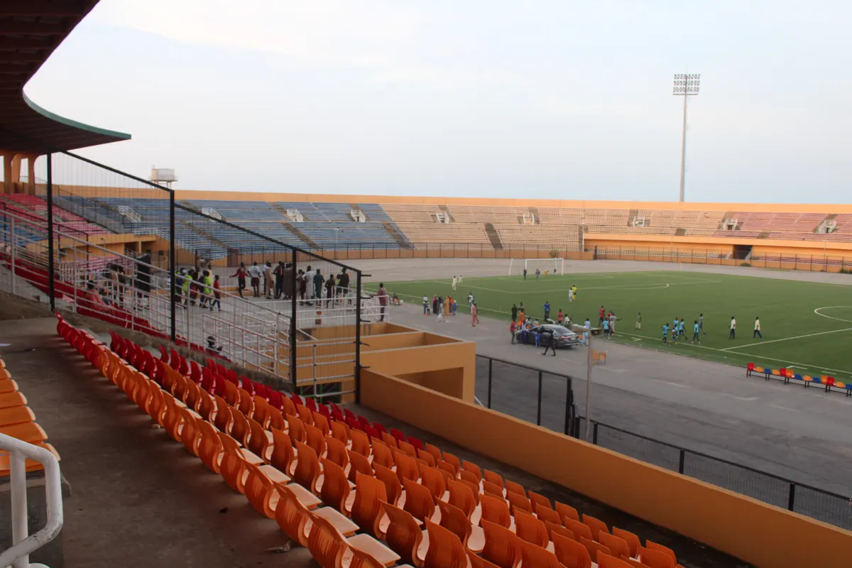 Fenced perimeter, orange seats and the pitch at Muhammadu Dikko Stadium in Katsina, home ground of Katsina United