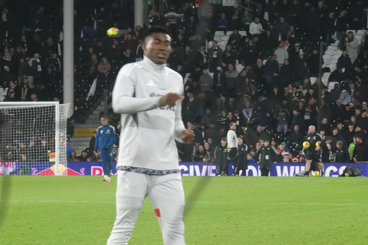 Taiwo Awoniyi warming up at Craven Cottage before a Premier League match in December 2025